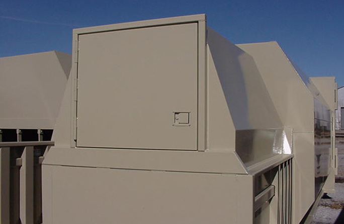 Self-Contained Compactor with Rear Feed Doghouse Install from Bakers Waste Equipment Compactor Solutions